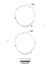 Blue and pink cord bracelets with wing details, beads and hanging stars.