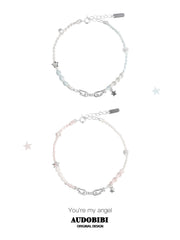 Blue and pink cord bracelets with wing details, beads and hanging stars.