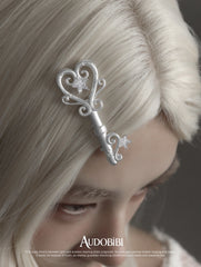 Winged Grace Key Hair Clip, shown worn by a model.