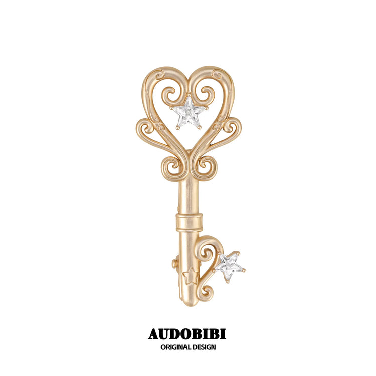 Winged Grace Key Hair Clip — Light Gold.