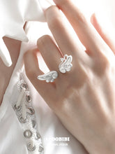 Winged Grace Dreamcore Angel Floating Wing Ring, shown worn by a model.