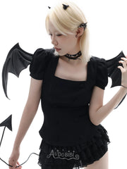 Angel and Devil leather straps with winged hardware, shown worn as bracelets.