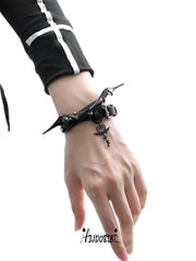 Angel and Devil leather straps with winged hardware, shown worn as bracelets.