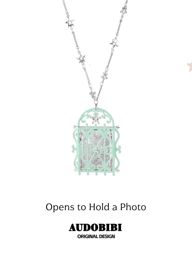 Window-shaped photo locket necklace, shown on the hand or wrist with other jewelry.