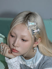 Lily Dreamlock Asymmetric Heart-Key Drop Earrings, shown worn by a model.