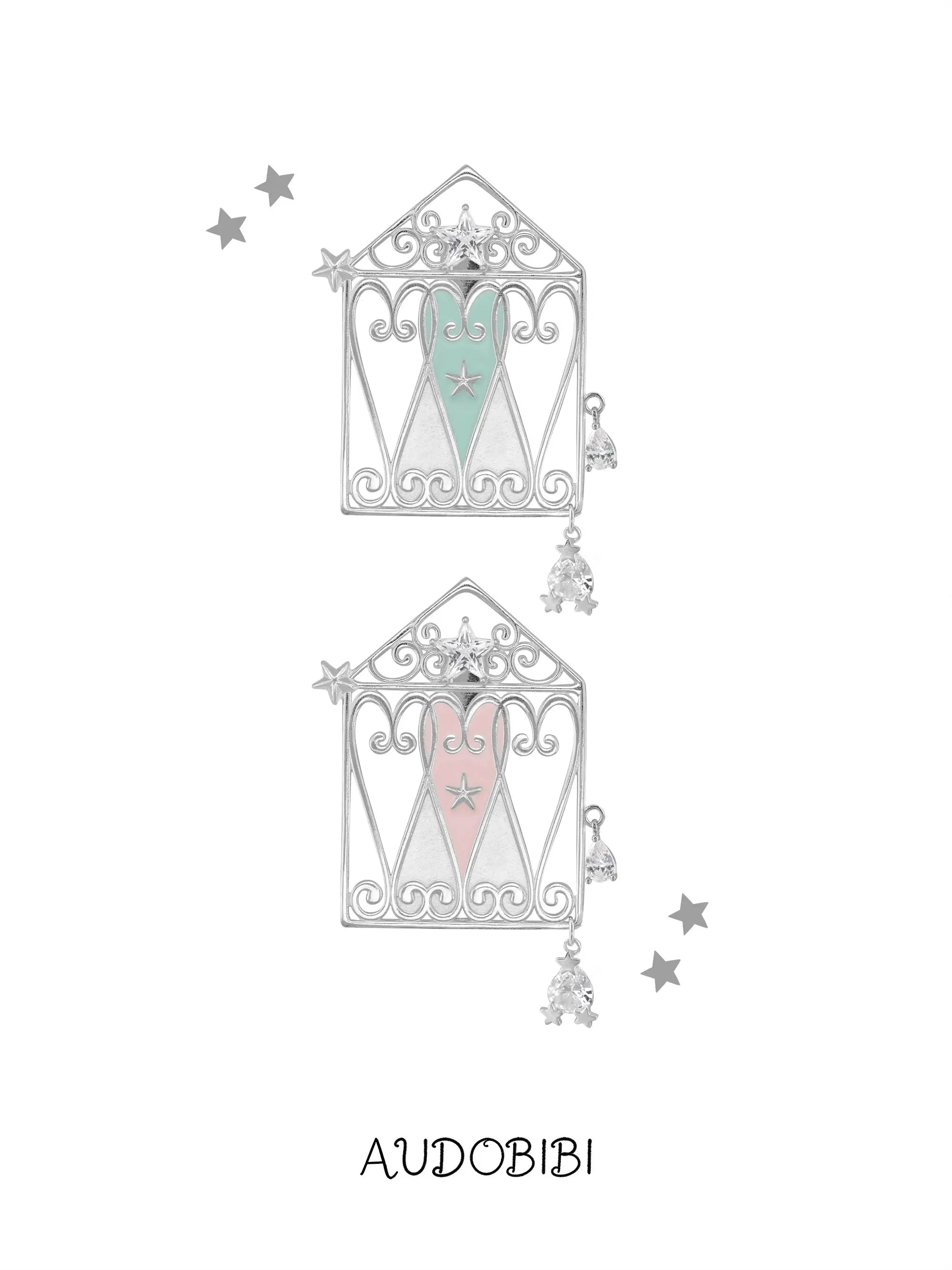 Mint and pink window-and-heart hair clips on a white background.