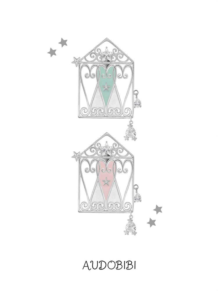 Mint and pink window-and-heart hair clips on a white background.