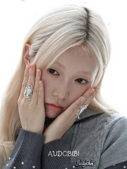 Lily Hidden Garden Zircon Window & Heart Ring, shown worn by a model.