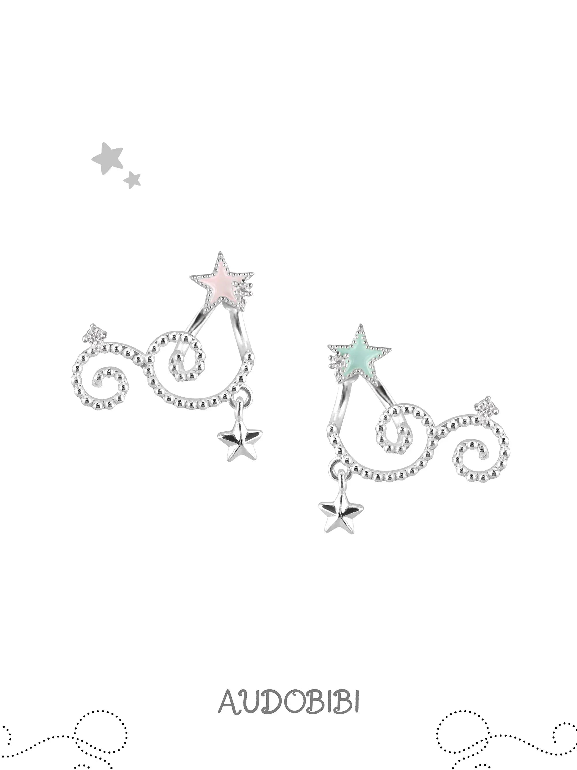 Mint and pink star studs with scrolling drops on a white background.