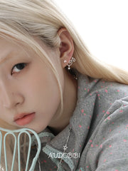 Lily Starvine Detachable Star Stud Earrings, shown worn by a model.