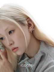 Lily Starvine Detachable Star Stud Earrings, shown worn by a model.