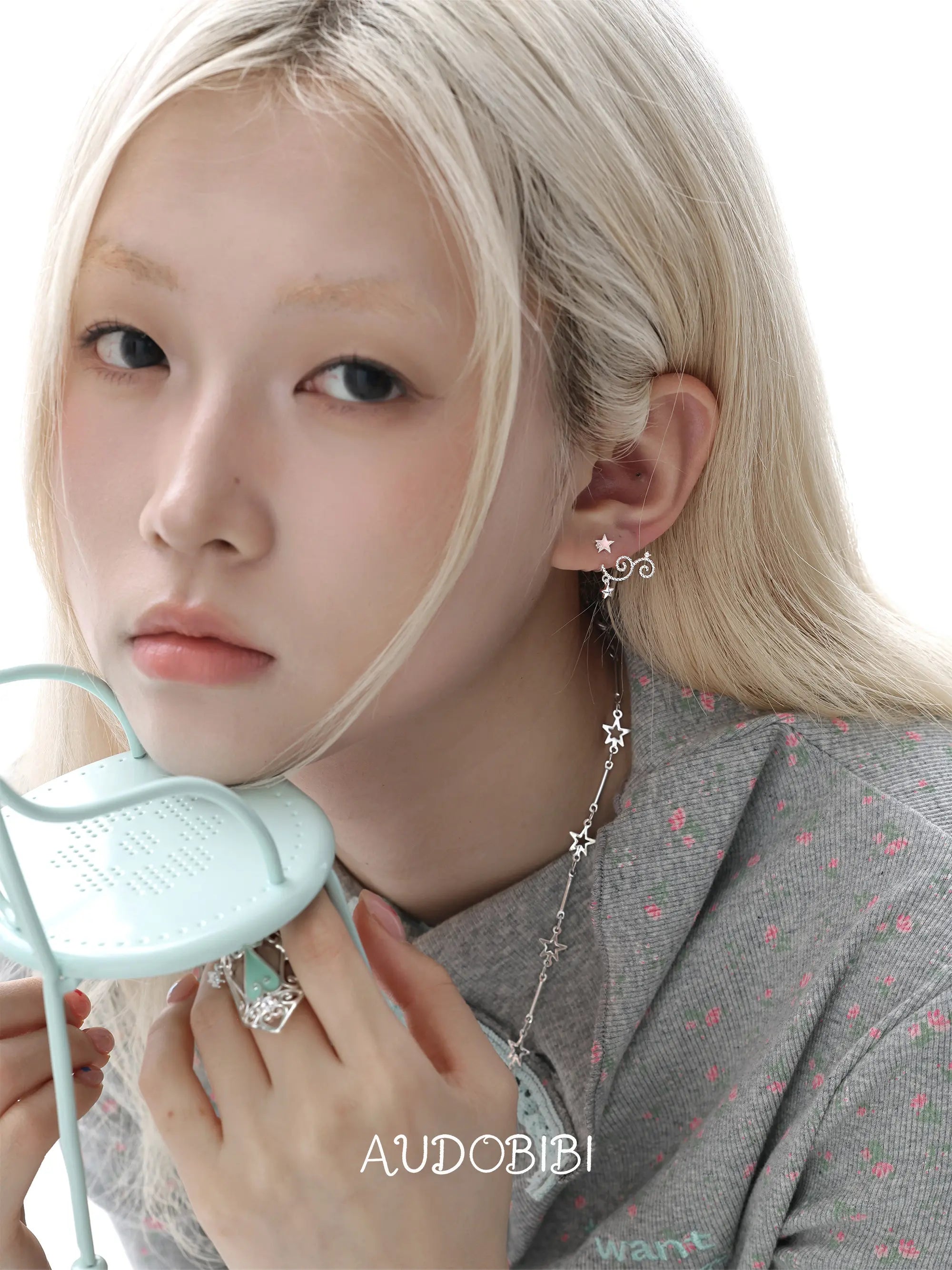 Lily Starvine Detachable Star Stud Earrings, shown worn by a model.