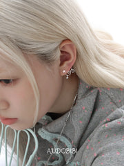 Lily Starvine Detachable Star Stud Earrings, shown worn by a model.