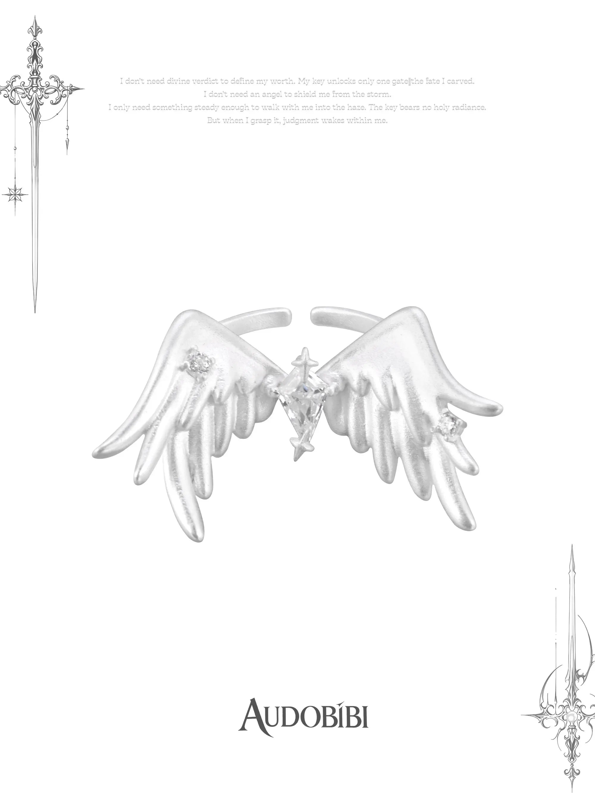 Open ring with raised feathered wings on a white background.