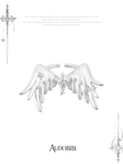 Open ring with raised feathered wings on a white background.