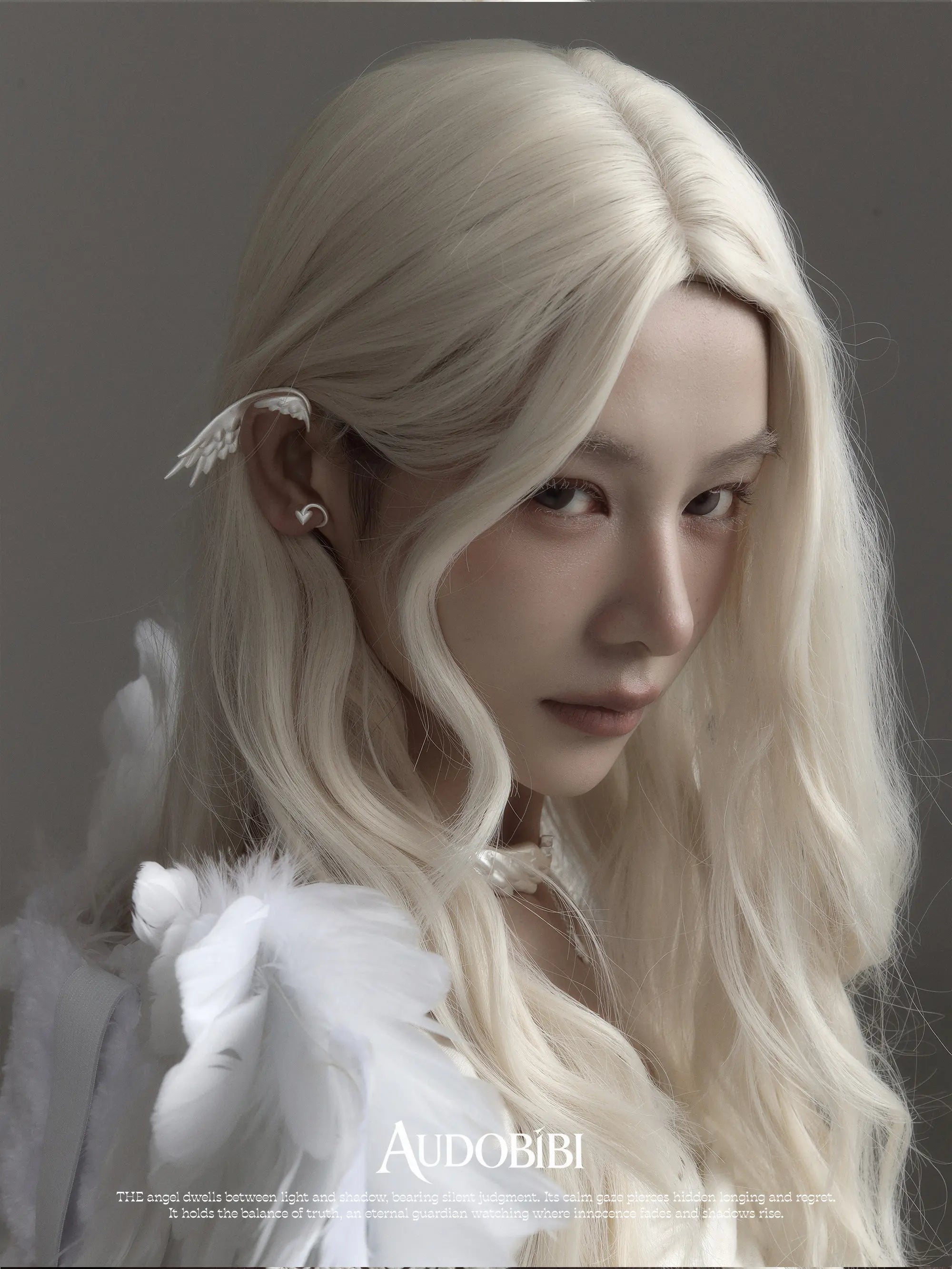 Wing ear cuff, worn with other jewelry in a model portrait.