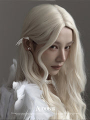 Wing ear cuff, worn with other jewelry in a model portrait.