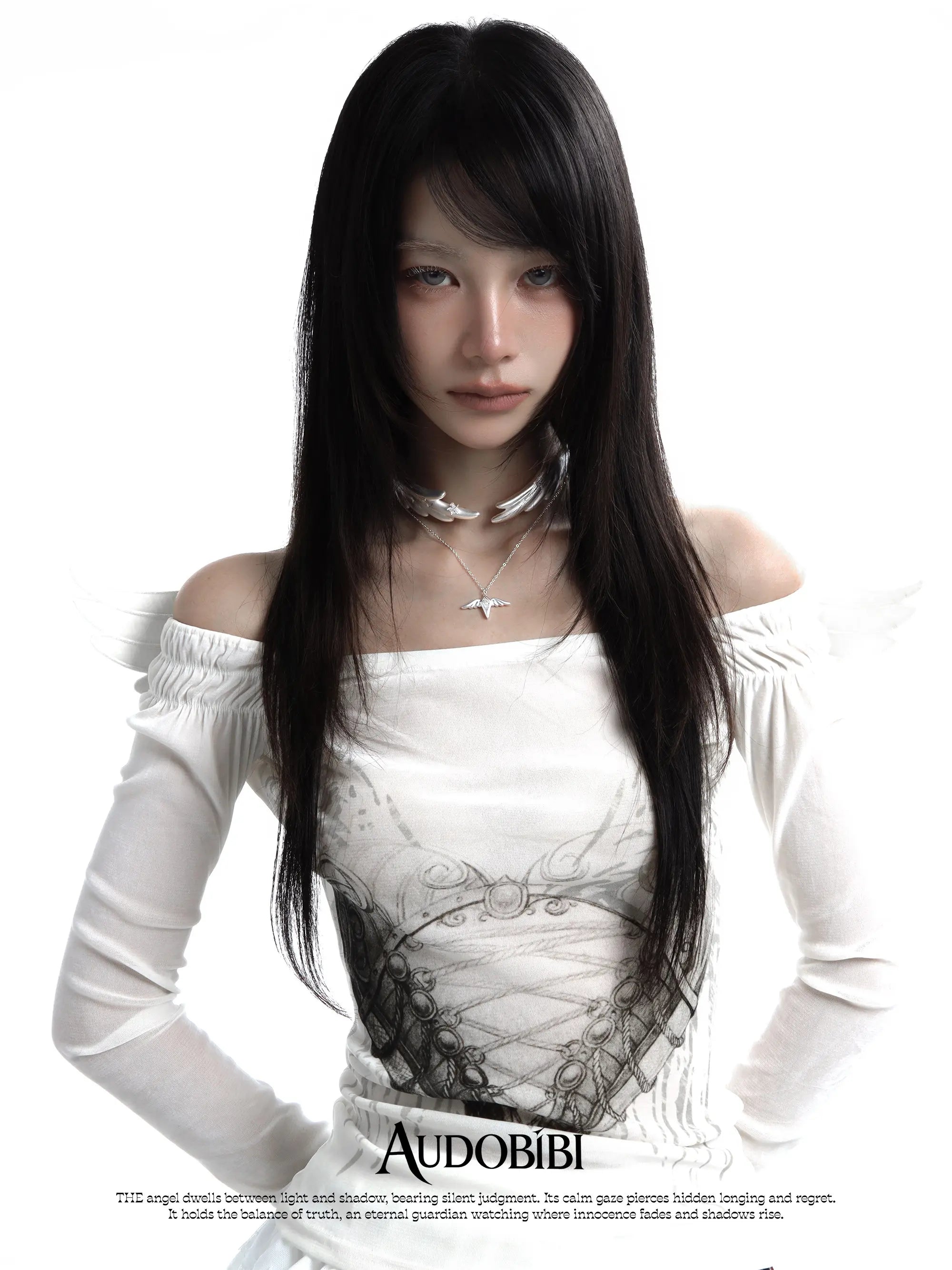 Wing choker with a draped chain, worn with other jewelry in a model portrait.
