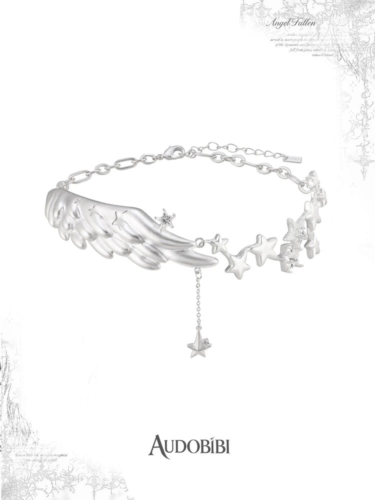 Wing-and-star pendant necklace with a small hanging star.