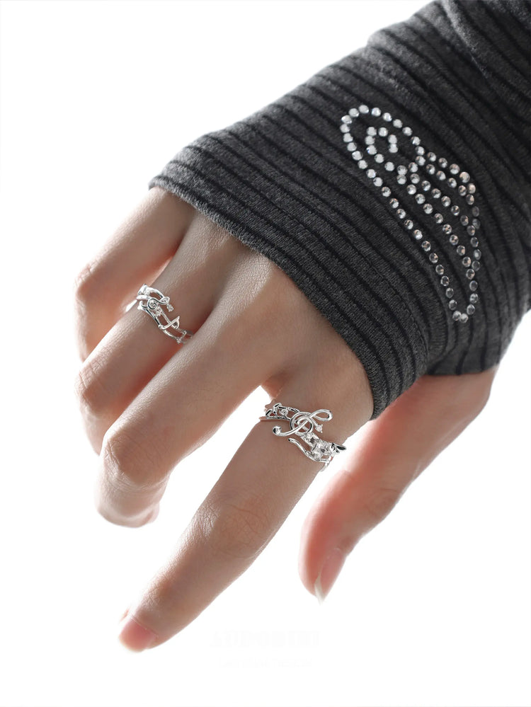 Winged Grace Memory Étude Musical Note Open Ring, shown worn by a model.