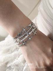 Winged Grace Judgment Angel Layered Bead Bracelet, shown worn by a model.