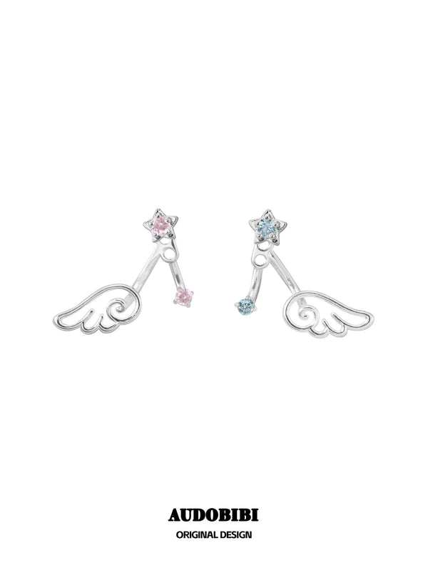 Pink and blue wing-and-star stud earring designs on a white background.