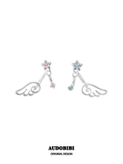 Pink and blue wing-and-star stud earring designs on a white background.