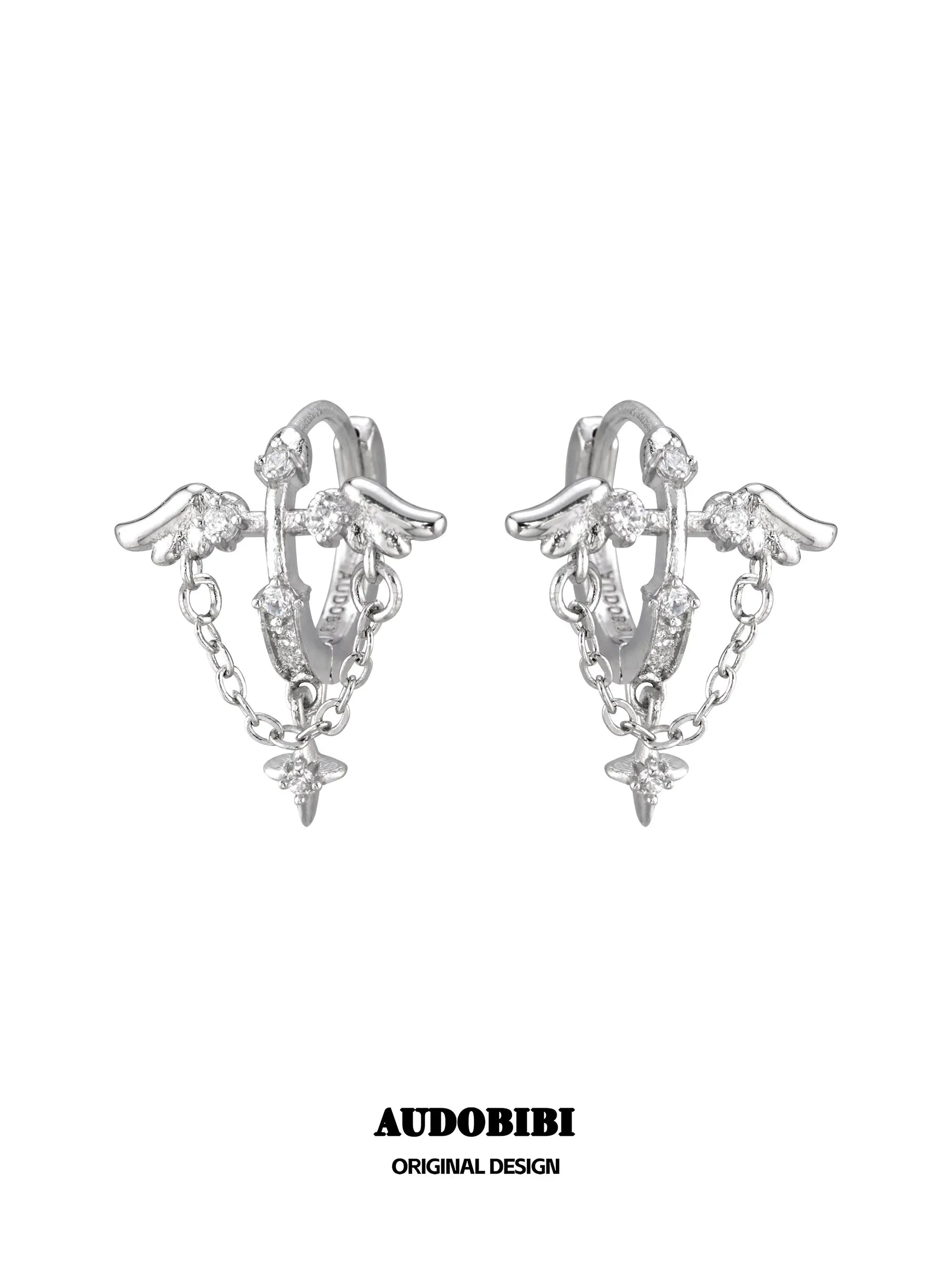 Wing hoop earrings with draped chains and hanging star details.