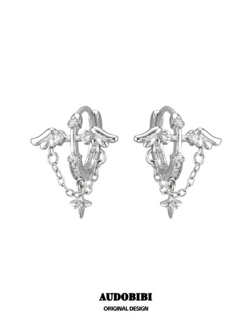 Wing hoop earrings with draped chains and hanging star details.