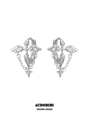 Wing hoop earrings with draped chains and hanging star details.
