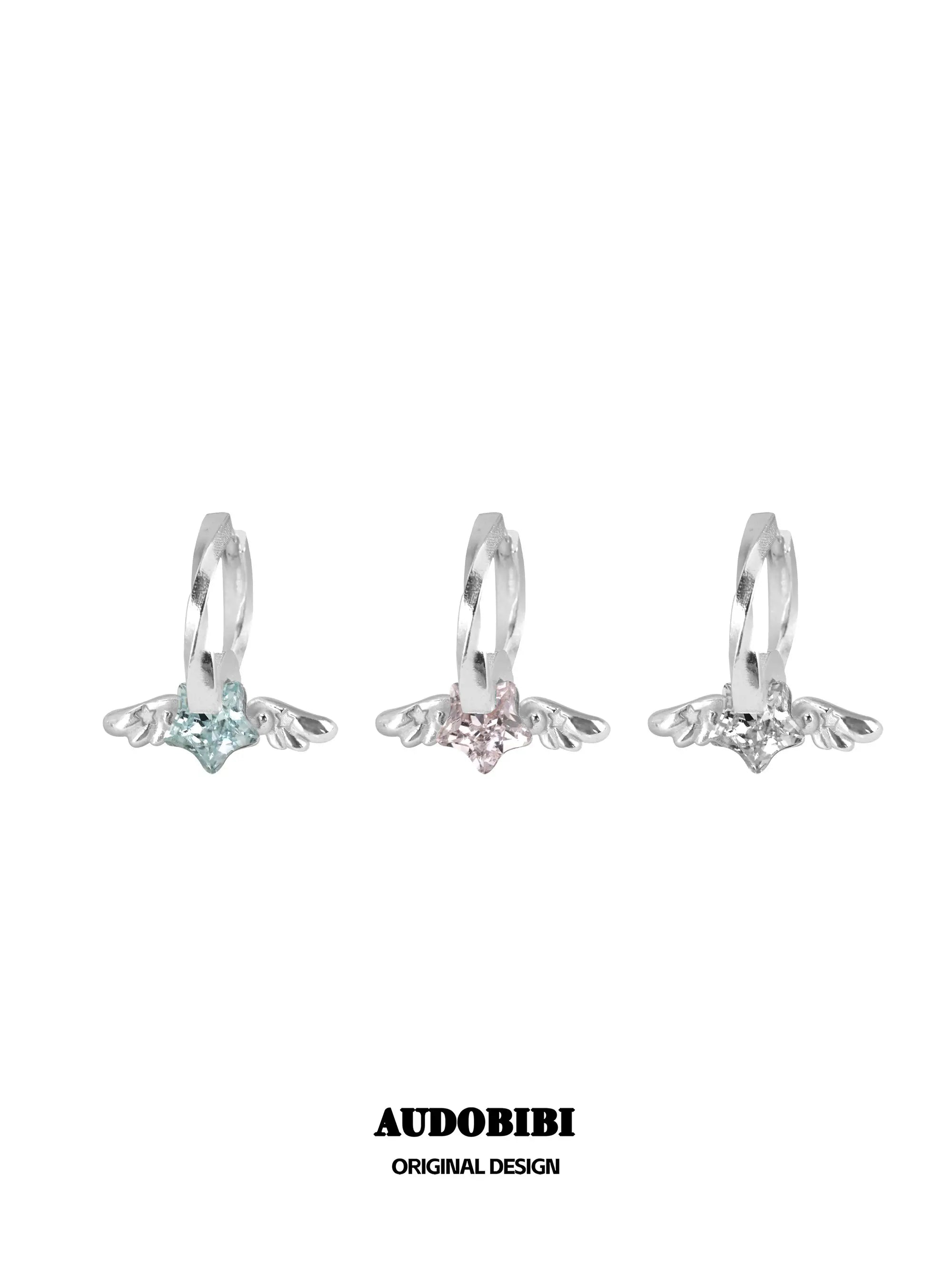 Mini wing hoop earrings shown in blue, pink and white.