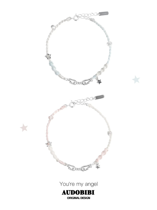 Blue and pink cord bracelets with wing details, beads and hanging stars.