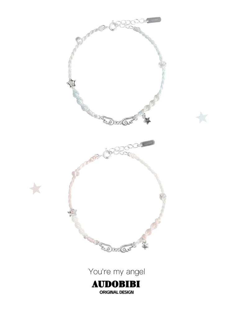 Blue and pink cord bracelets with wing details, beads and hanging stars.