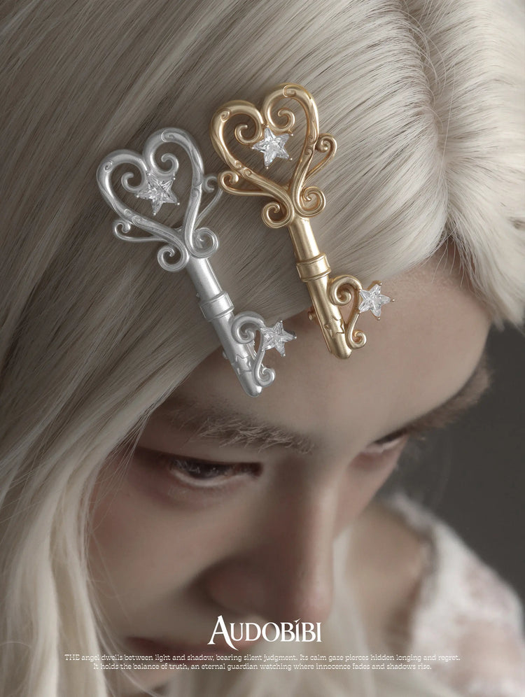 Winged Grace Key Hair Clip, shown worn by a model.
