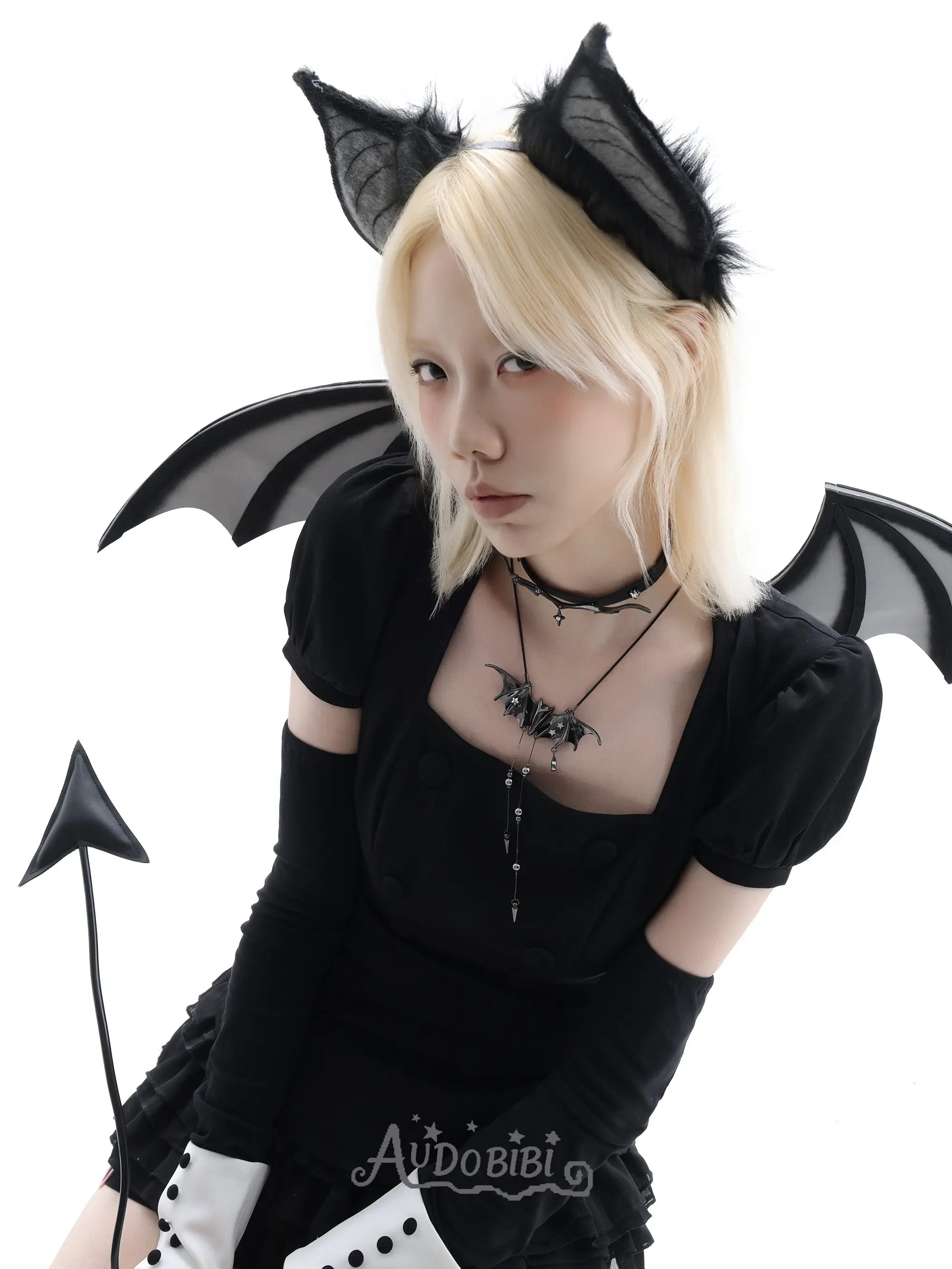 Angel and Devil leather straps with winged hardware, shown worn as bracelets.