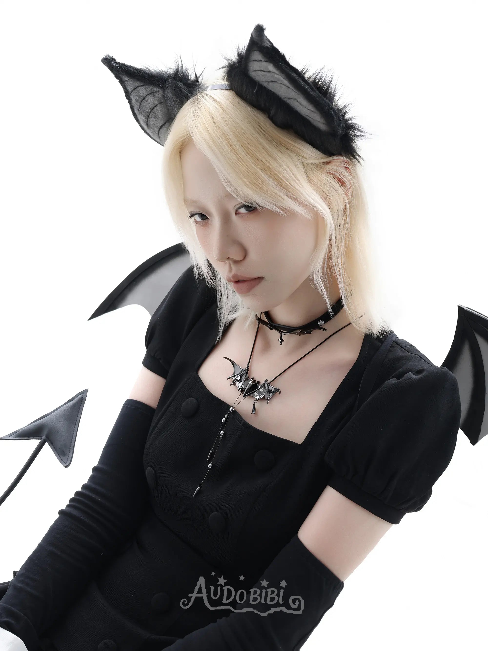 Angel and Devil leather straps with winged hardware, shown worn as bracelets.