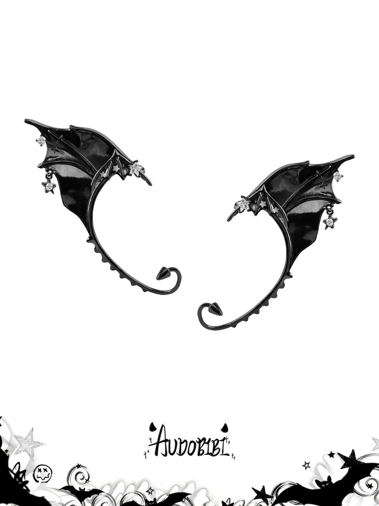 Left and right black bat-wing ear cuffs on a white background.