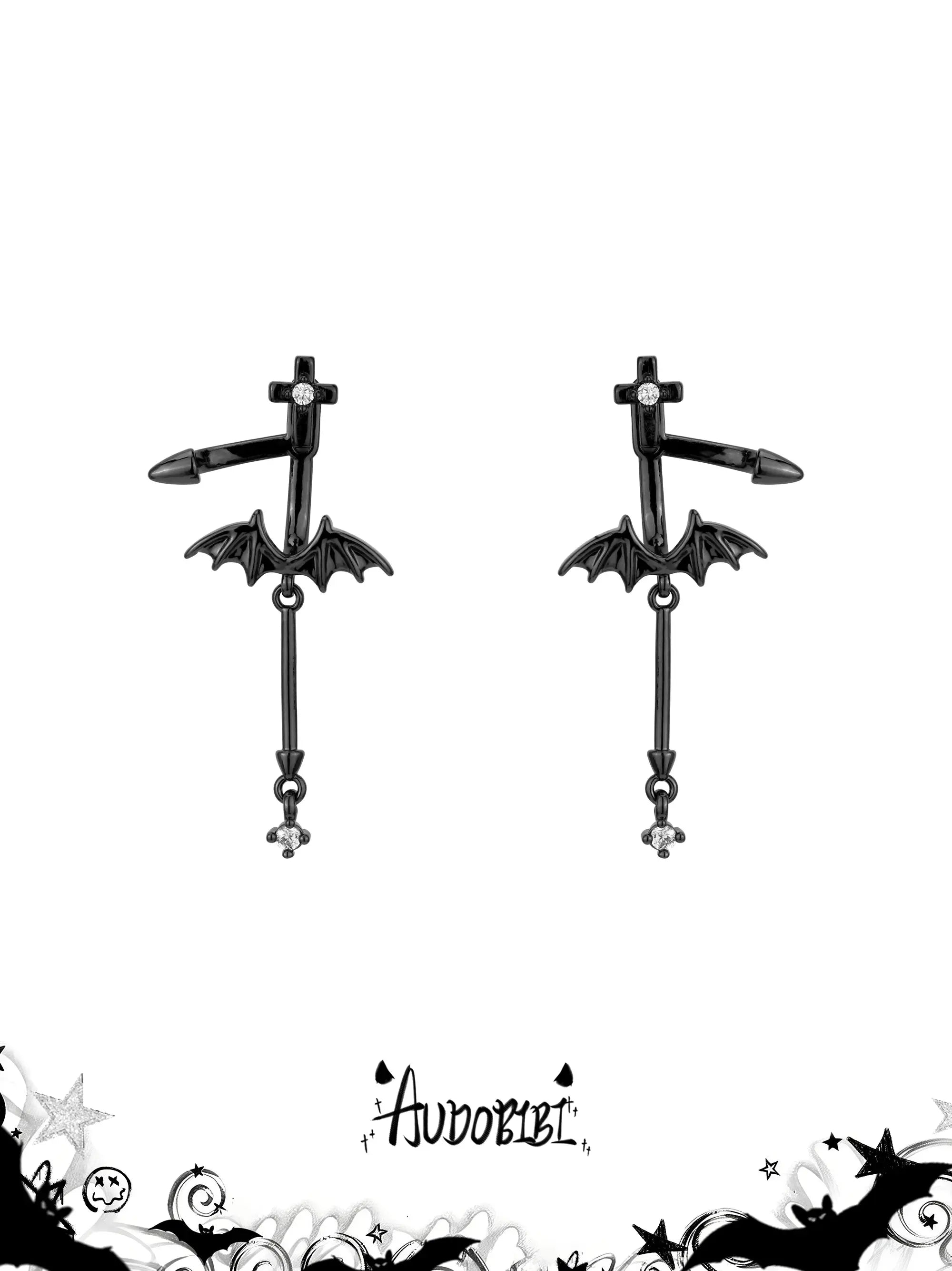 Black bat-wing drop earrings on a white background.