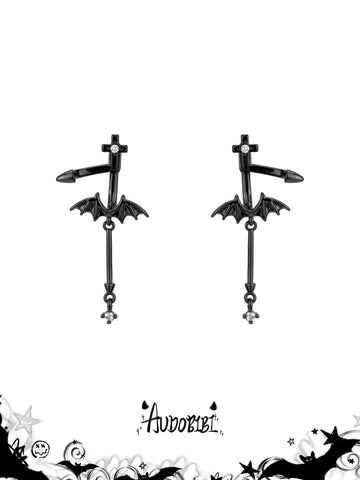 Black bat-wing drop earrings on a white background.
