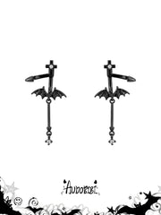 Black bat-wing drop earrings on a white background.