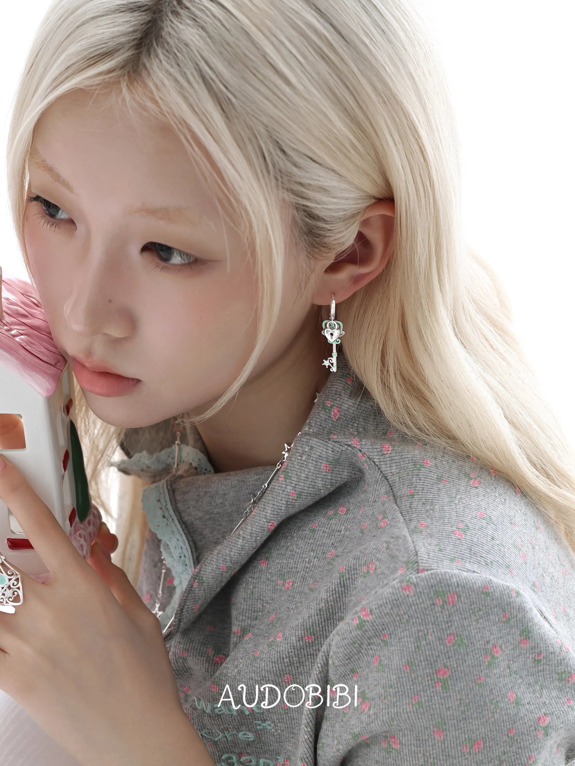 Lily Dreamlock Asymmetric Heart-Key Drop Earrings, shown worn by a model.