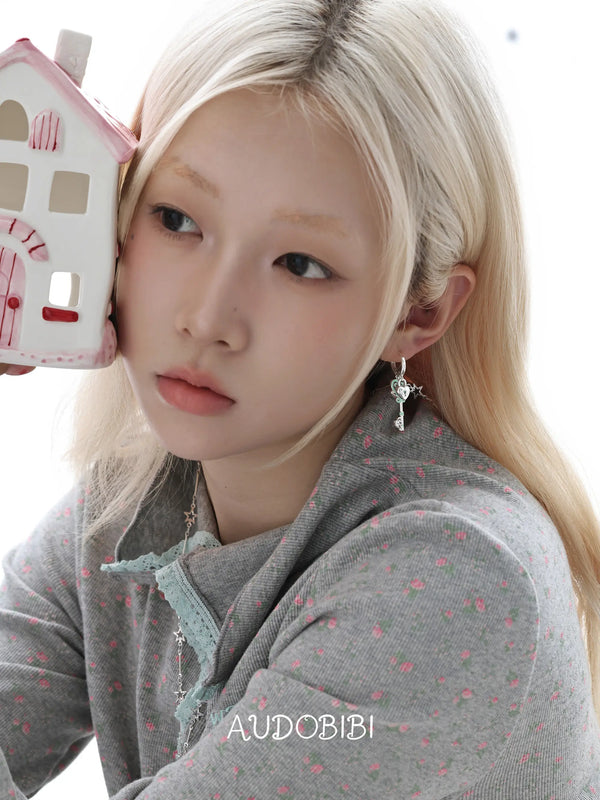 Lily Dreamlock Asymmetric Heart-Key Drop Earrings, shown worn by a model.