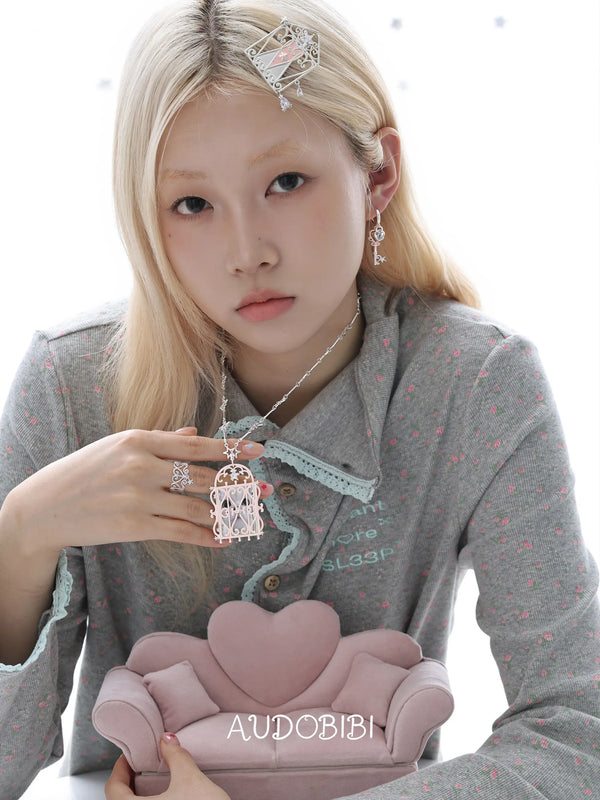 Lily Dreamlock Asymmetric Heart-Key Drop Earrings, shown worn by a model.