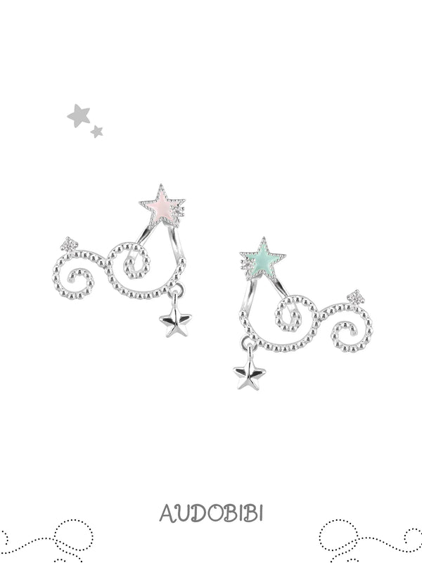 Mint and pink star studs with scrolling drops on a white background.