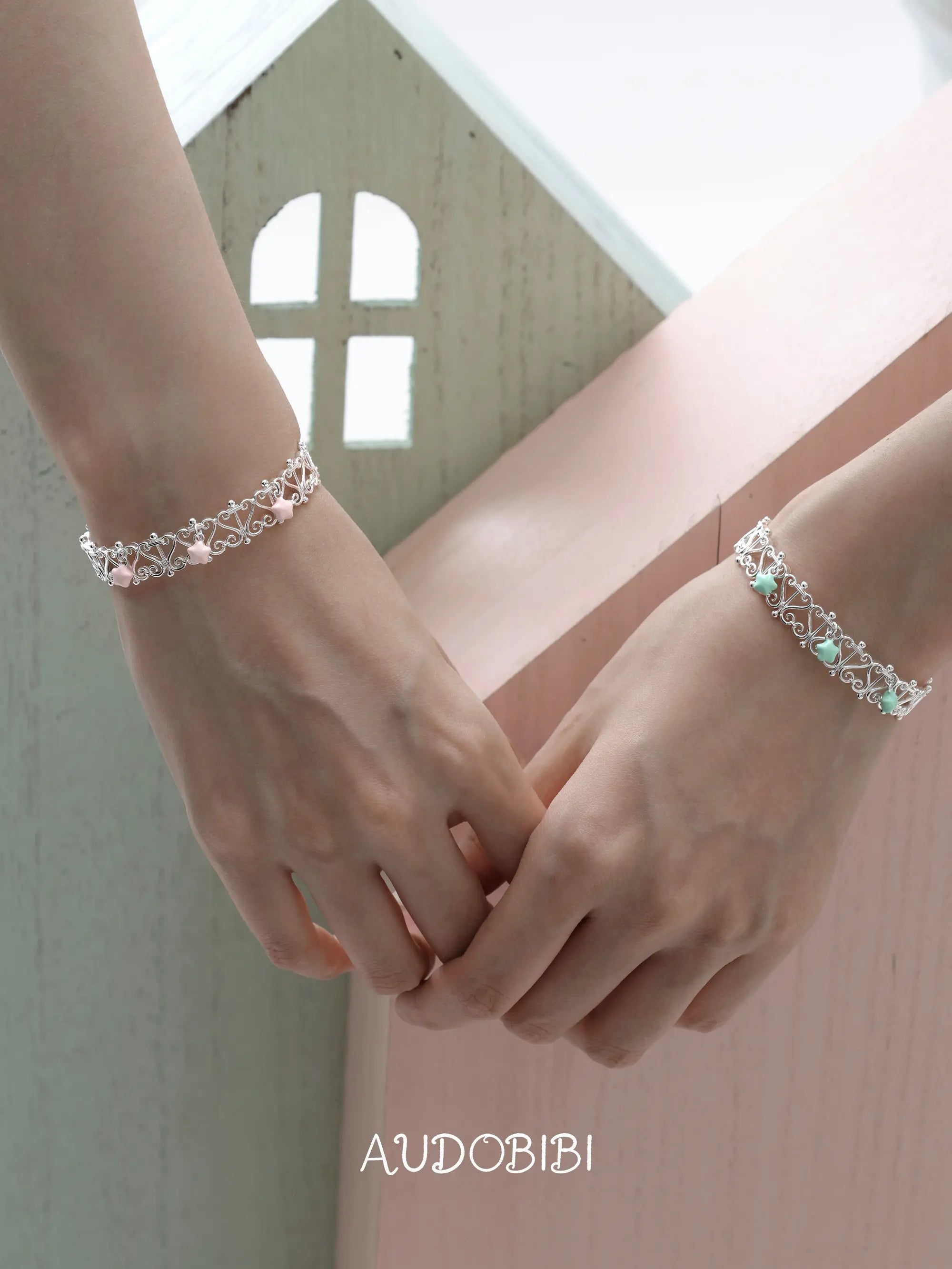 Lily Starvine Openwork Window Bangle, shown worn by a model.