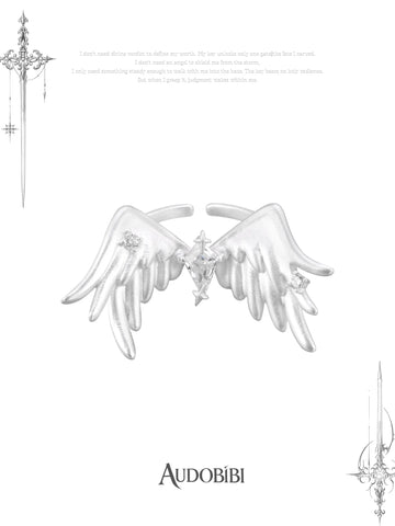 Open ring with raised feathered wings on a white background.
