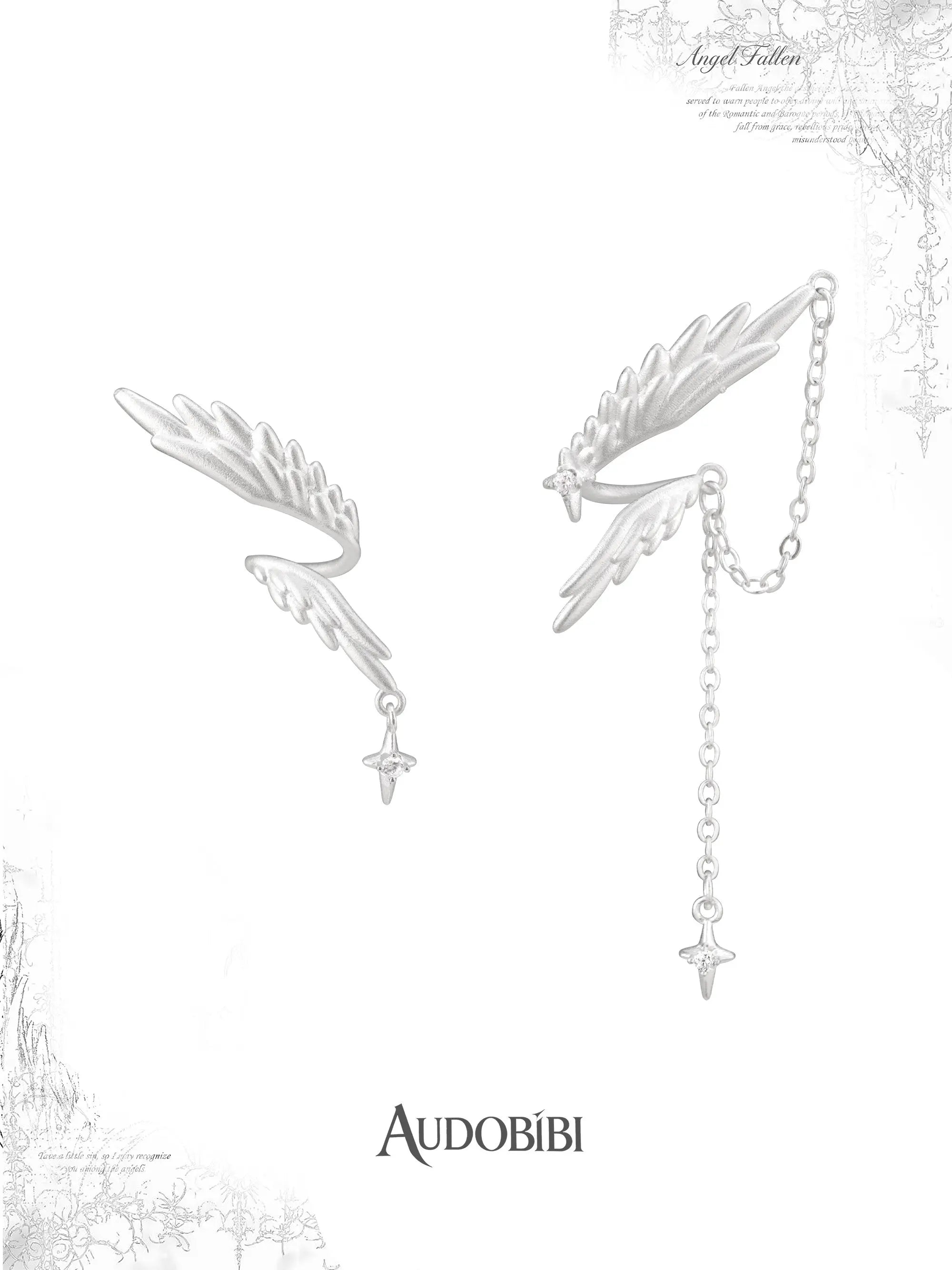 Asymmetric wing earrings with feather and chain drops on a white background.