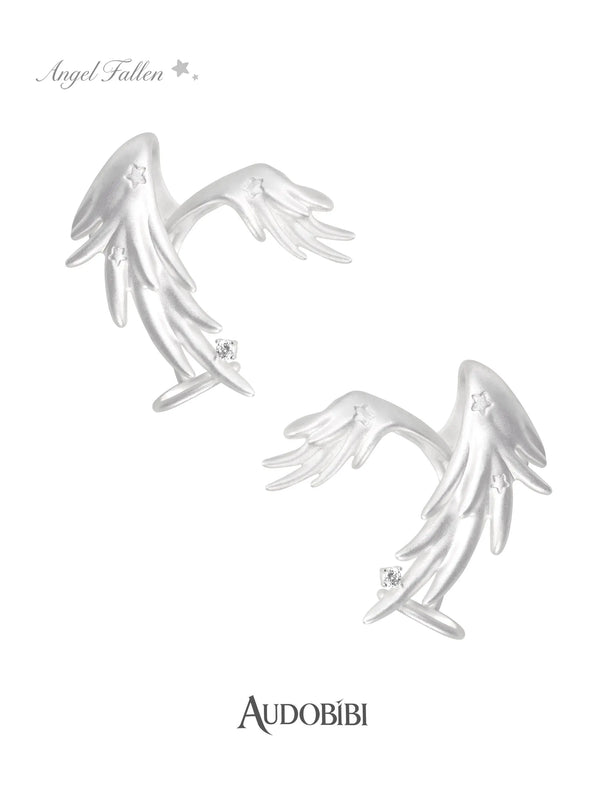 Two long wing ear cuffs on a white background.