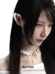 Long wing ear cuffs, shown in a close-up of the ear.