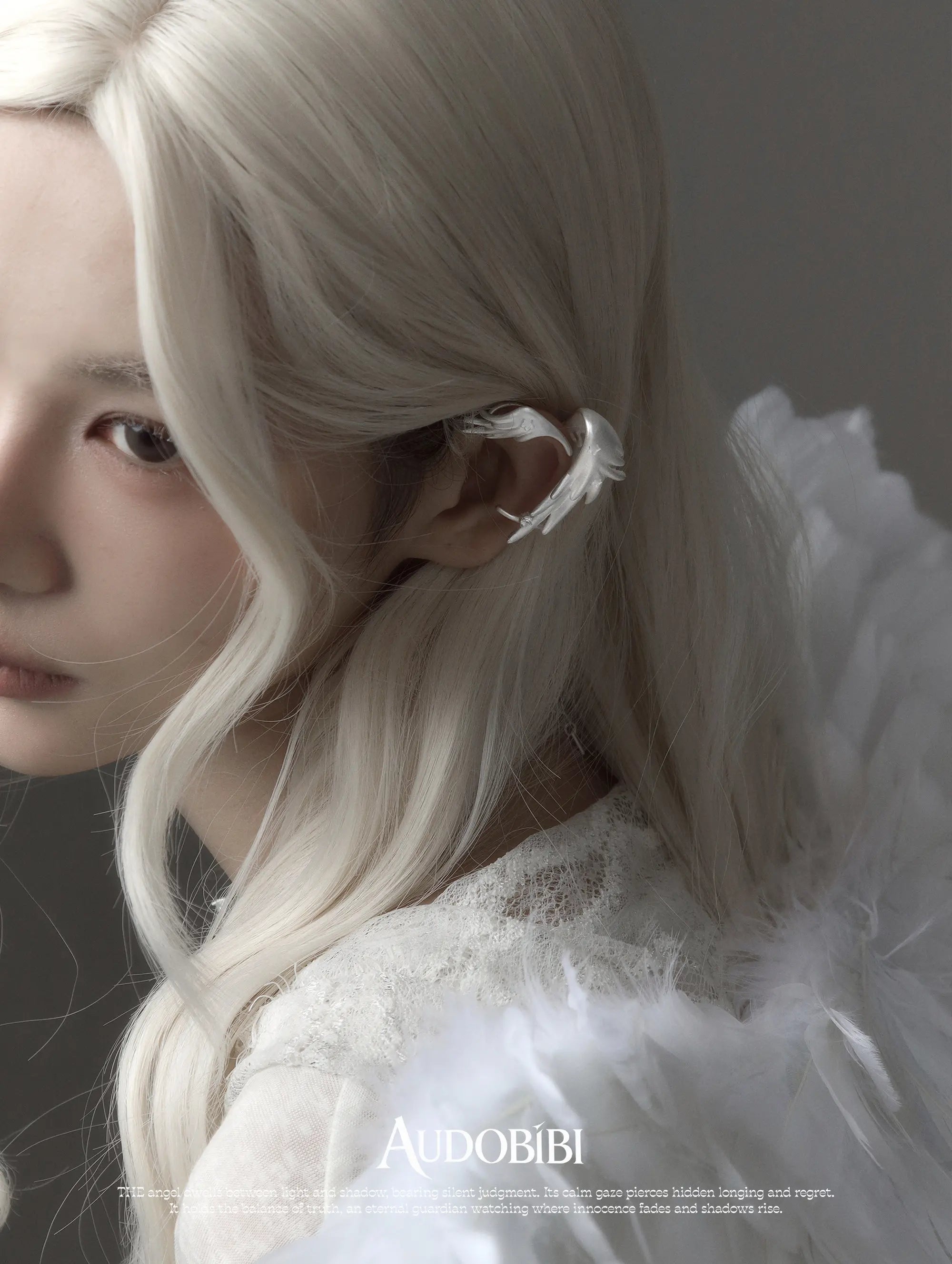 Winged Grace Judgment Angel Long Wing Ear Cuff, shown worn by a model.